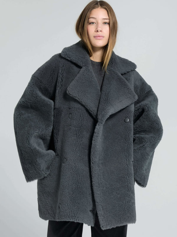 Cozy oversized gray faux fur coat by MEOTINE, featuring a wide collar and large buttons, perfect for stylish winter layering.