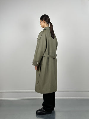 A model wearing a stylish olive green trench coat from MEOTINE, showcasing a relaxed fit and elegant design from the back.