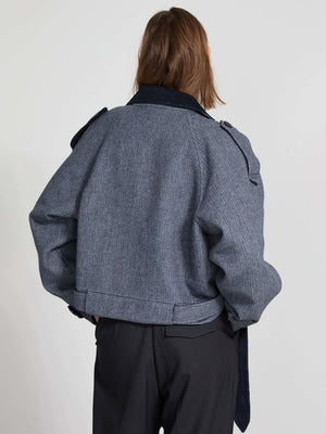 Stylish cropped jacket in a textured navy fabric, featuring a classic collar and shoulder epaulettes, by MEOTINE.
