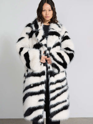 Stylish black and white striped faux fur coat by MEOTINE, featuring a relaxed fit and oversized silhouette, perfect for winter.