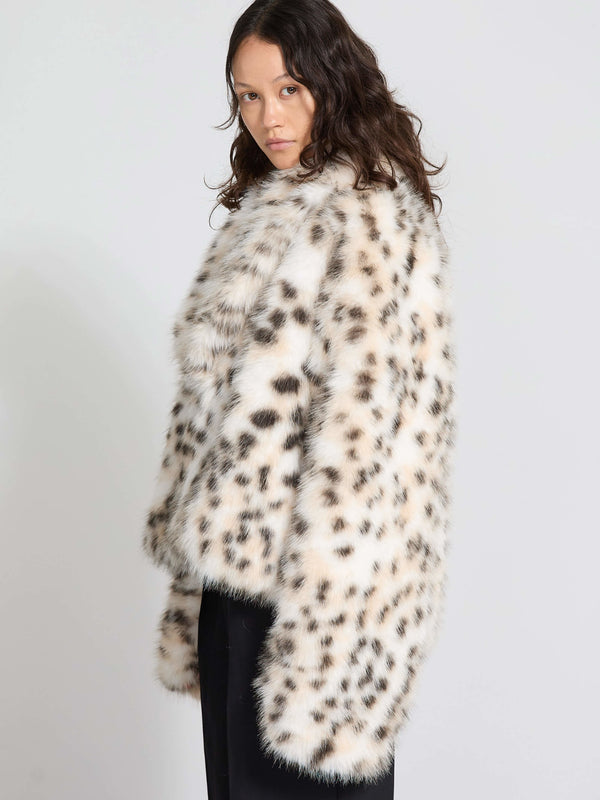 A model showcases a stylish MEOTINE leopard print faux fur coat, featuring a relaxed fit and soft texture, perfect for winter fashion.