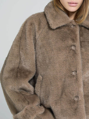 Cozy brown faux fur jacket with a classic collar and button closure, perfect for stylish warmth by MEOTINE.