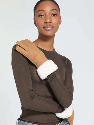 Stylish gloves with a soft white cuff, worn by a model in a brown long-sleeve top, showcasing MEOTINE's elegant design.
