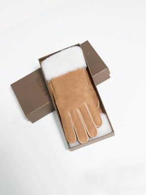 Stylish tan gloves with a soft white lining, presented in a sleek box, perfect for winter warmth by MEOTINE.