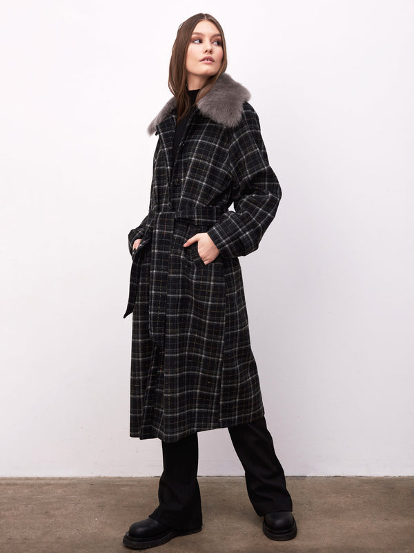 A model showcases a stylish black and gray plaid coat with a fur collar, embodying MEOTINE's chic winter fashion.