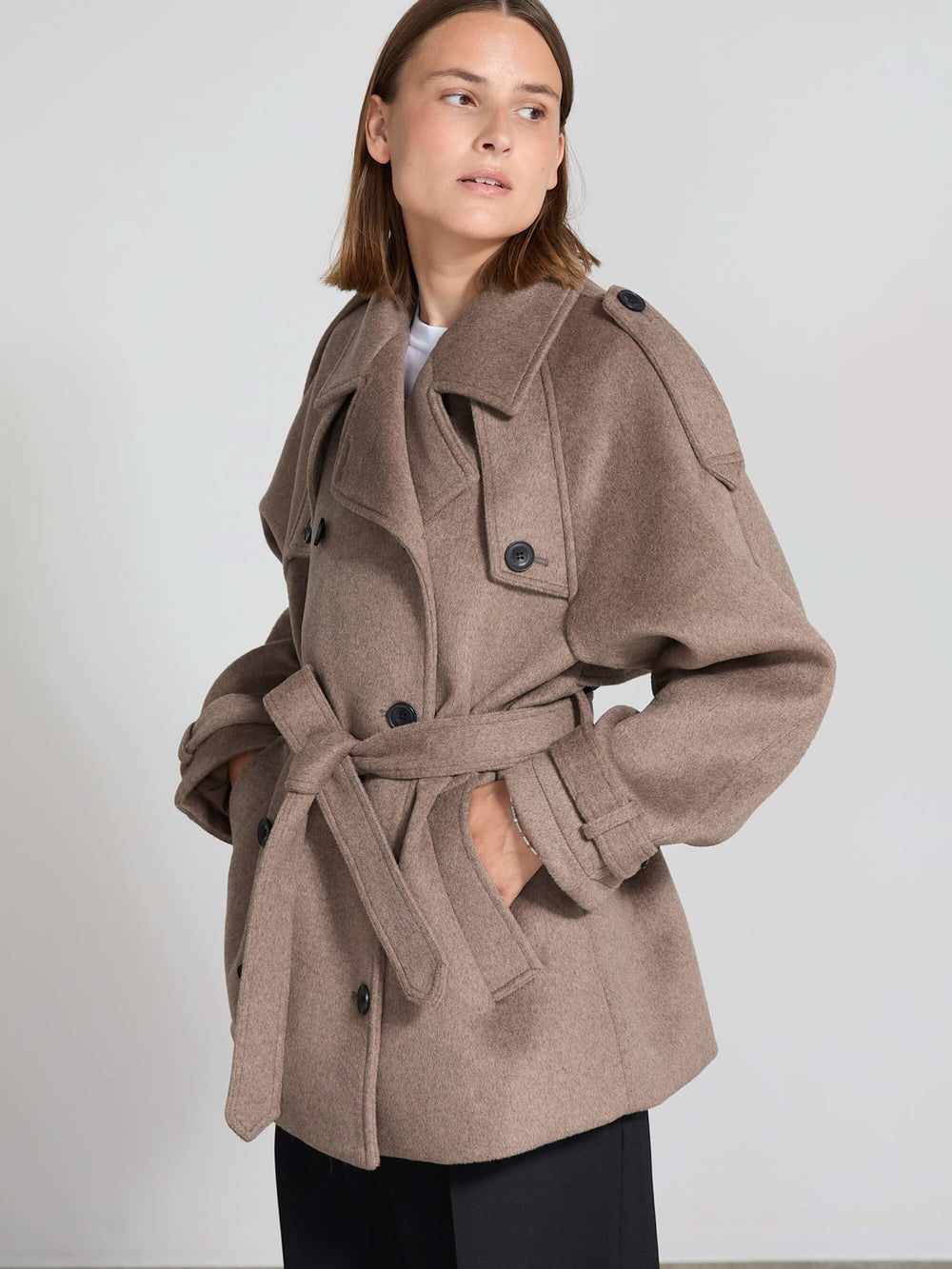 Stylish brown belted coat with a structured silhouette, featuring large buttons and a cozy collar, perfect for a chic look by MEOTINE.