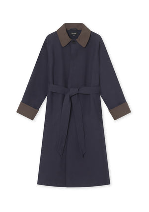 Stylish navy trench coat with a brown collar and cuffs, featuring a belted waist for a flattering fit. Perfect for any occasion. MEOTINE.