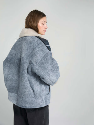 Cozy oversized gray jacket with a soft fur collar, perfect for a stylish winter look. Designed by MEOTINE.