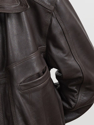 Brown leather jacket featuring a stylish design with pockets, perfect for a chic look. Ideal for any casual occasion. MEOTINE.